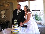 Jen and Dave cutting their wedding cake.