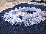 Garter that I made for Jen using storebought basics and bits of scraps from my wedding dress and veil.
