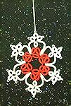 This lovely tatted snowflake was made and designed by Wendy Durell. It's a 4 ring snowflake.