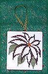 This ornament was cross stitched by Nancy Kuelbs. She choose a design by Prittercup Designs called "Poinsettia" from the just Corss Stitch 2007 ornament magazine. Nacny loves the effect of their outli