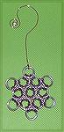 Ornament by Patricia Tenpenny
Patricia got her ornament from Step by Step Wire Jewelery,Vol. 6, No. 6 Dec. - Jan. 2011. Project was called Snowflakes. She use pink jump rings to make her ornamnet.