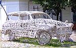 Just stumbled across this.. was in a generic sort of post.. no info as to who, or where.. I doubt anyone can answer the "why"!  It's a simple picture of somebody's crafting project - a knitted car scu
