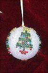 This ornament was designed and made with glass beads and pins on a styrofoam ball by Patricia Tenpenny.