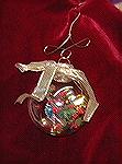 This ornament was made by Colleen Poor. She made it to show some of the fun things of Christsa - tree, sparkly things, etc.