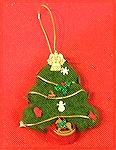 This needle felted Christmas tree was designed and made by Colleen Poor. She used a cookie cutter for the mold. She filled it first with white wool roving, followed by the colored roving.