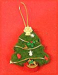 This needle felted Christmas tree was designed and made by Colleen Poor. She used a cookie cutter for the mold. She filled it first with white wool roving, followed by the colored roving.