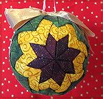 This ornament was done by Kyra Tenpenny. It's a no sew quilted ornmament.