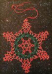 This snowflake is tatted from a pattern by Jennifer Williams. It was tatted by Wendy Durell.