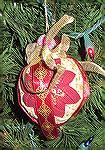 This ornament was made by Colleen Poor. It is a no sew quilted ornament with Colleen's special touches added.