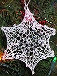 This ornament was made by Micki McCrillis. This ornament was made from a Ravelry pattern, Snowy by tinyknits.