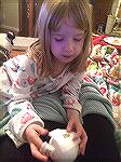Eva not feeling well but trying to help mommy make ornaments.
Kyra