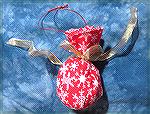 Small wrapped ornament made by Colleen Poor.
