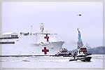 March 30, 2020 hospital ship arriving in NY, with Statue of Liberty in the background
